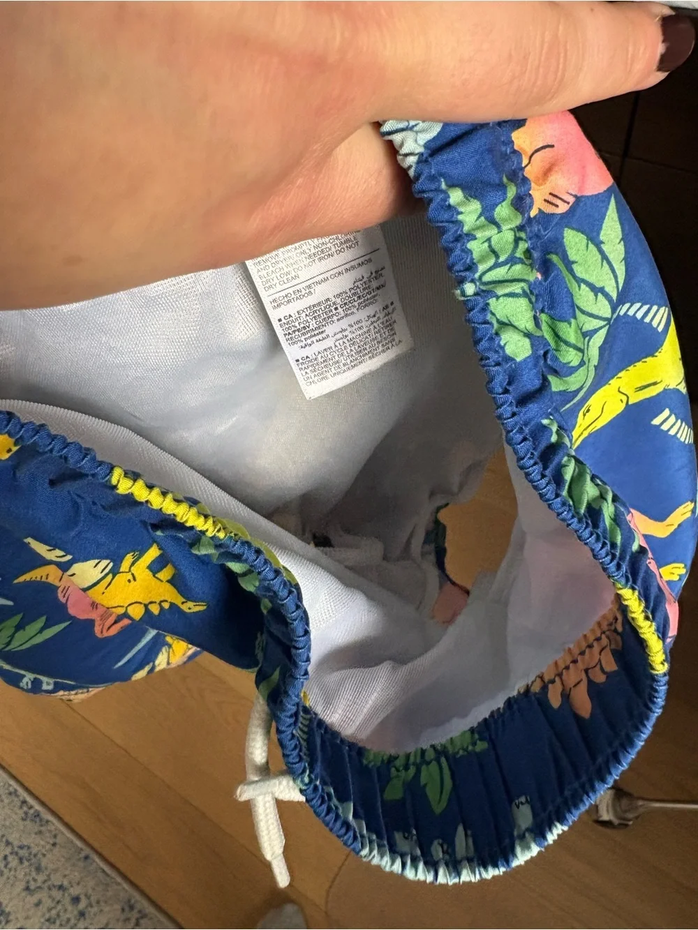 Old Navy dinosaur swim trunks - size 4